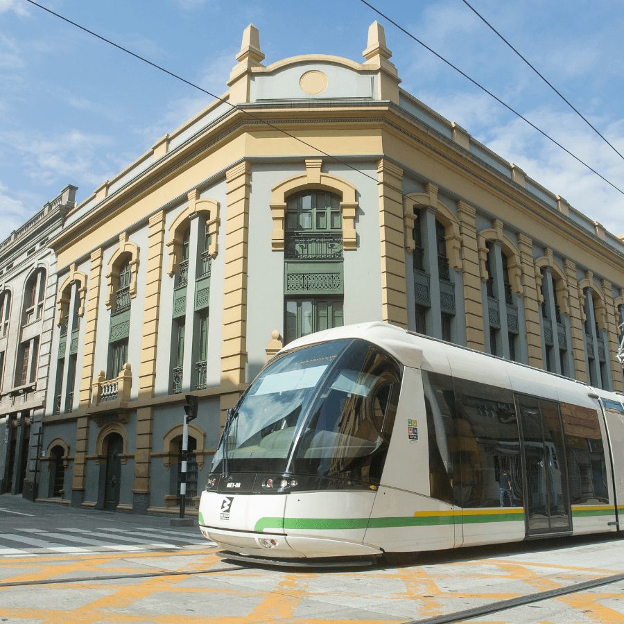 Ayacucho tram in front of a historic building in Medellín, Colombia